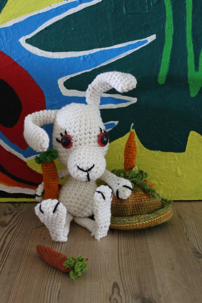 crochet rabbit with rasta-cap and painting