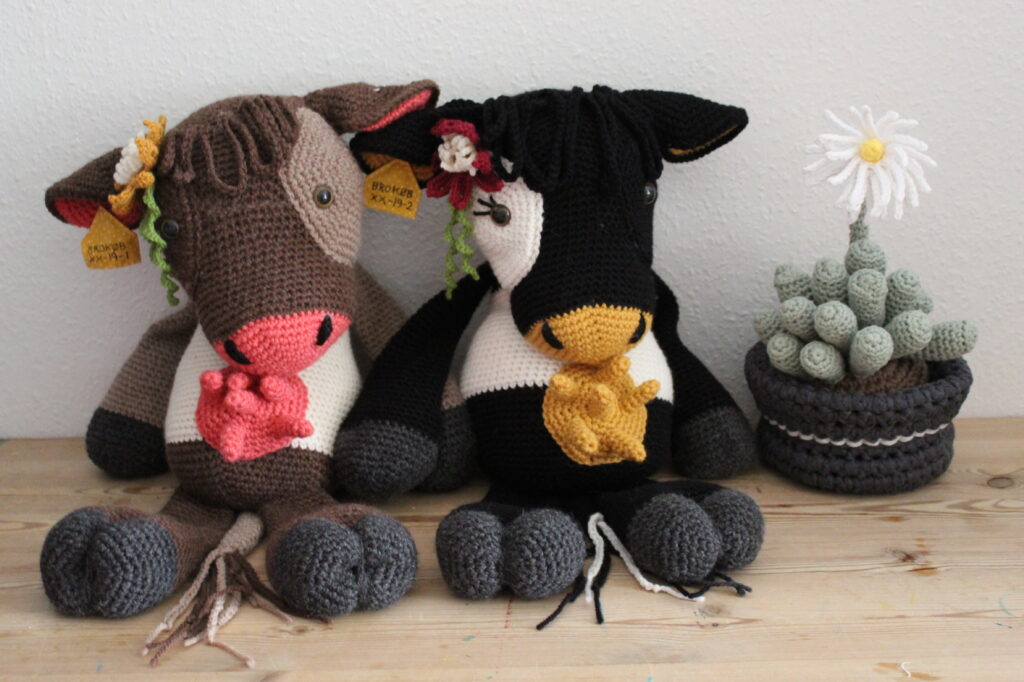 two chrochet cows with flowers - bodil, emmy and fenestraria
